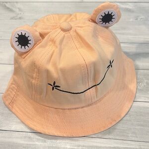 Women’s Peach Bucket Hat with Eyes and a Smile!